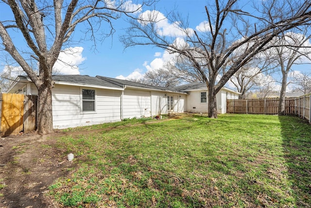 view of yard with a fenced backyard