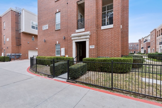 view of building exterior with fence