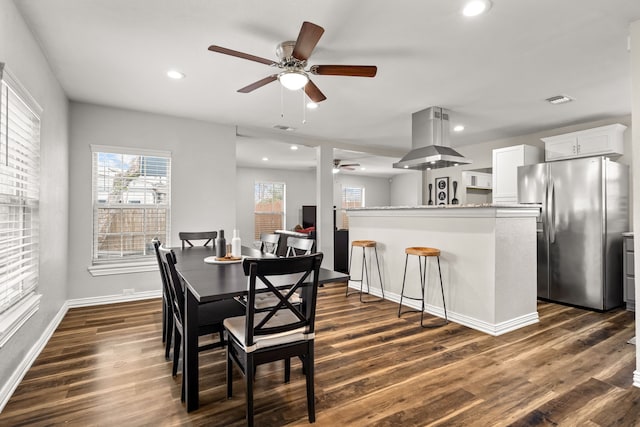 dining area featuring dark wood-style floors, baseboards, visible vents, and recessed lighting