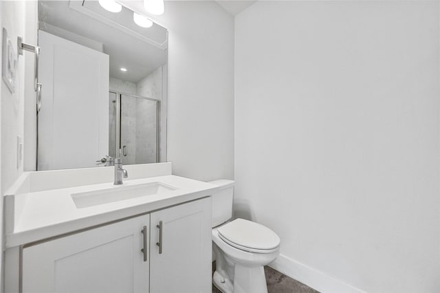 3200 Ross Ave Unit 40, Dallas, TX 75204 - bathroom with toilet, a stall shower, vanity, and baseboards