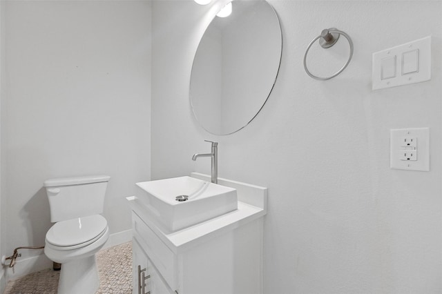 3200 Ross Ave Unit 40, Dallas, TX 75204 - bathroom featuring vanity, toilet, and baseboards