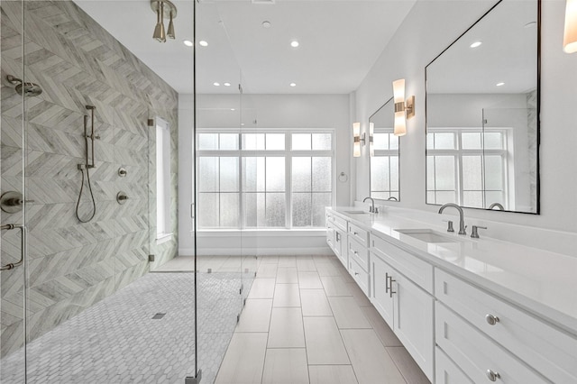 3200 Ross Ave Unit 40, Dallas, TX 75204 - bathroom featuring a stall shower, double vanity, recessed lighting, and tile patterned floors