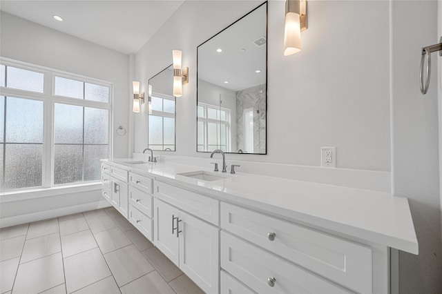 3200 Ross Ave Unit 40, Dallas, TX 75204 - full bathroom with double vanity, tile patterned flooring, a shower, and recessed lighting