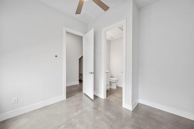 3200 Ross Ave Unit 40, Dallas, TX 75204 - unfurnished bedroom featuring finished concrete floors, baseboards, ensuite bathroom, and a ceiling fan