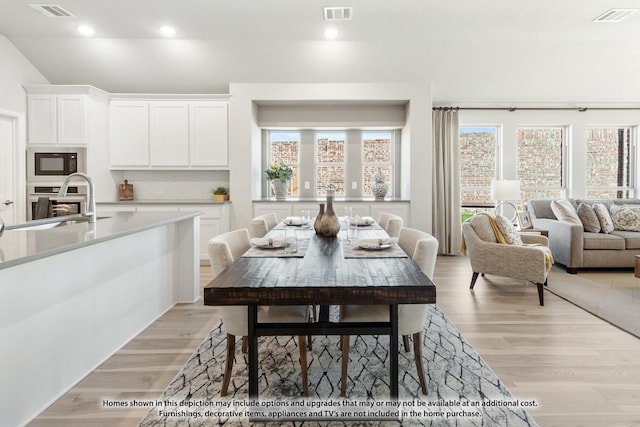 210 Shawnee Trl, Alvarado, TX 76009 - dining area featuring light wood finished floors and visible vents