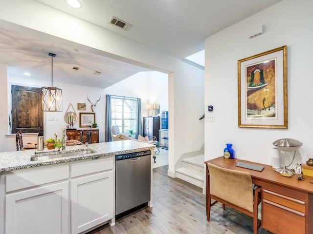 kitchen with visible vents, white cabinets, dishwasher, pendant lighting, and a sink