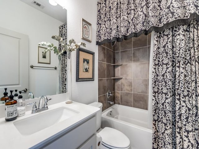 full bathroom featuring toilet, vanity, visible vents, and shower / bathtub combination with curtain