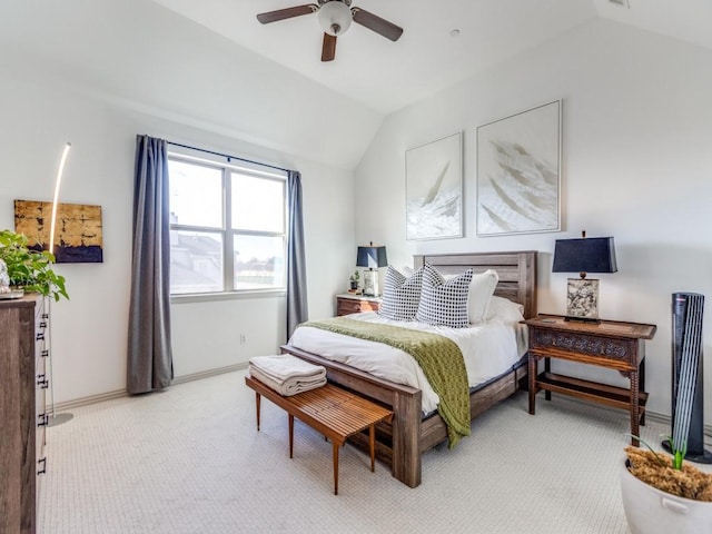 bedroom featuring lofted ceiling, light carpet, ceiling fan, and baseboards