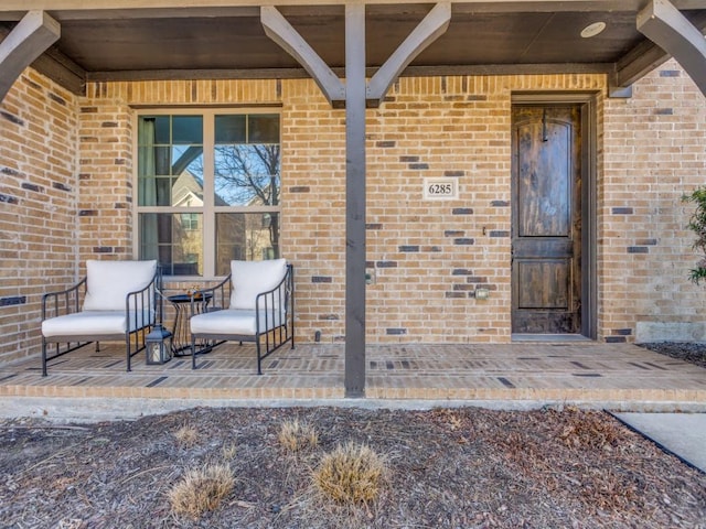 property entrance with brick siding