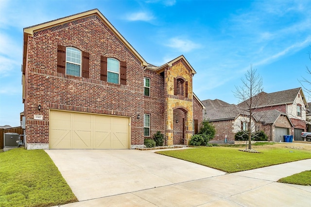 view of front of home featuring a front yard, concrete driveway, brick siding, and stone siding