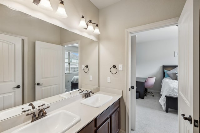 ensuite bathroom with a sink, double vanity, and ensuite bath