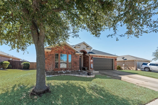 single story home with brick siding, fence, a garage, driveway, and a front lawn