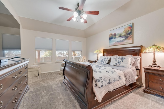 carpeted bedroom with baseboards, a ceiling fan, and lofted ceiling