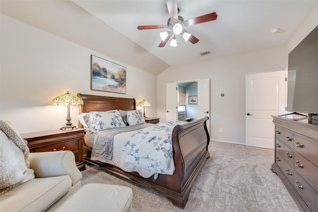 bedroom featuring visible vents, baseboards, ceiling fan, vaulted ceiling, and light carpet
