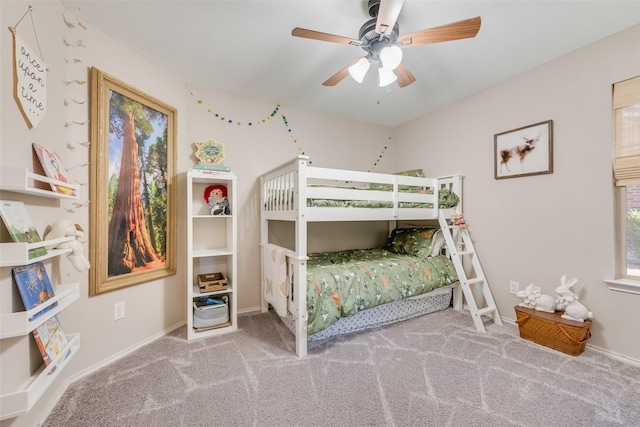 bedroom featuring baseboards, a ceiling fan, and carpet