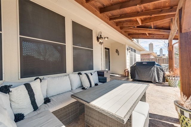 view of patio / terrace featuring a grill, an outdoor living space, and fence