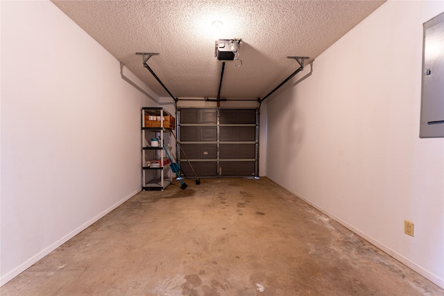 garage featuring baseboards, electric panel, and a garage door opener