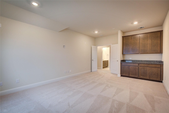 interior space with light carpet, baseboards, visible vents, and recessed lighting