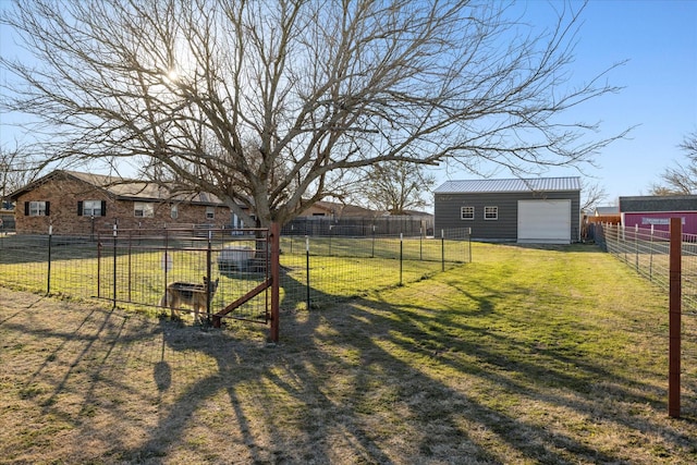 view of yard with fence and an outbuilding