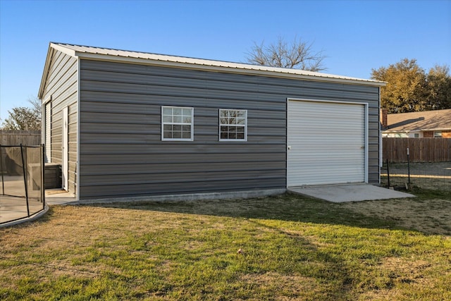 garage with fence