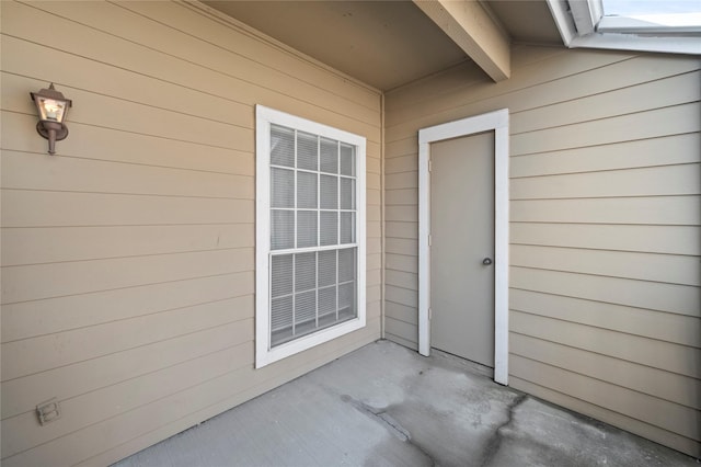 doorway to property with a patio area