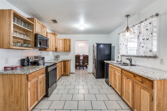 kitchen featuring light stone counters, open shelves, visible vents, appliances with stainless steel finishes, and a sink