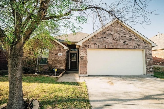 ranch-style house featuring an attached garage, driveway, and brick siding