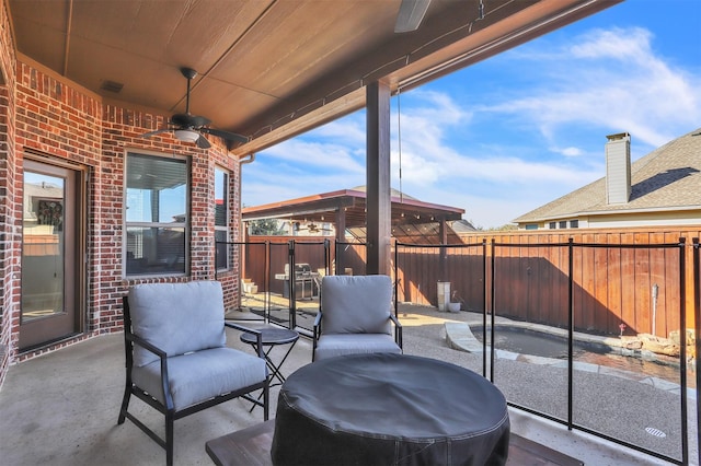 view of patio / terrace featuring area for grilling, fence private yard, and a ceiling fan