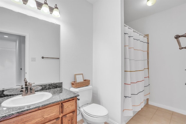 bathroom featuring curtained shower, vanity, toilet, and tile patterned floors