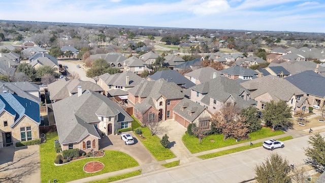 birds eye view of property with a residential view