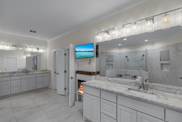 bathroom featuring marble finish floor, crown molding, a marble finish shower, visible vents, and a sink