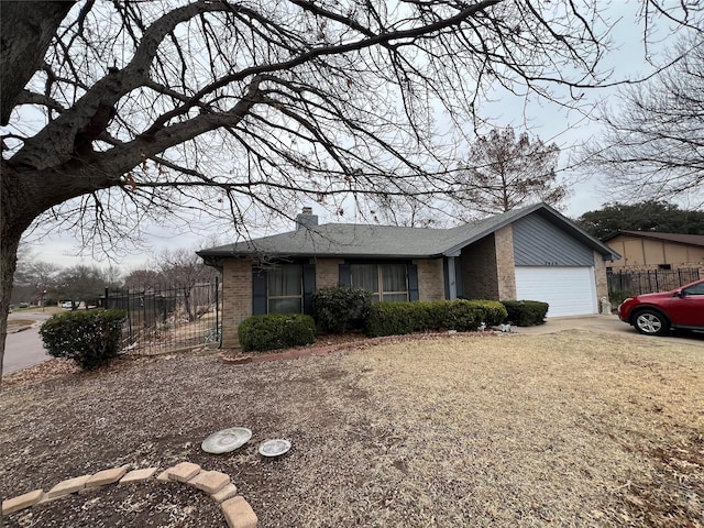 view of front facade featuring concrete driveway, brick siding, an attached garage, and fence