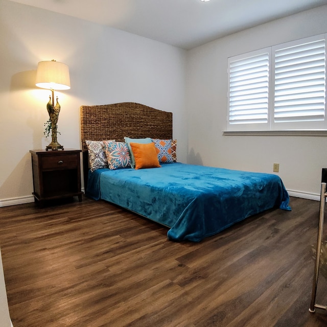 9005 Cumberland Dr, Irving, TX 75063 - bedroom with wood finished floors and baseboards