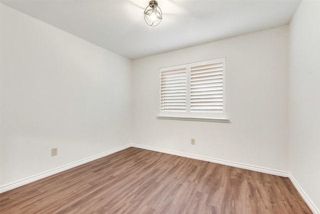 9005 Cumberland Dr, Irving, TX 75063 - unfurnished room with wood finished floors and baseboards