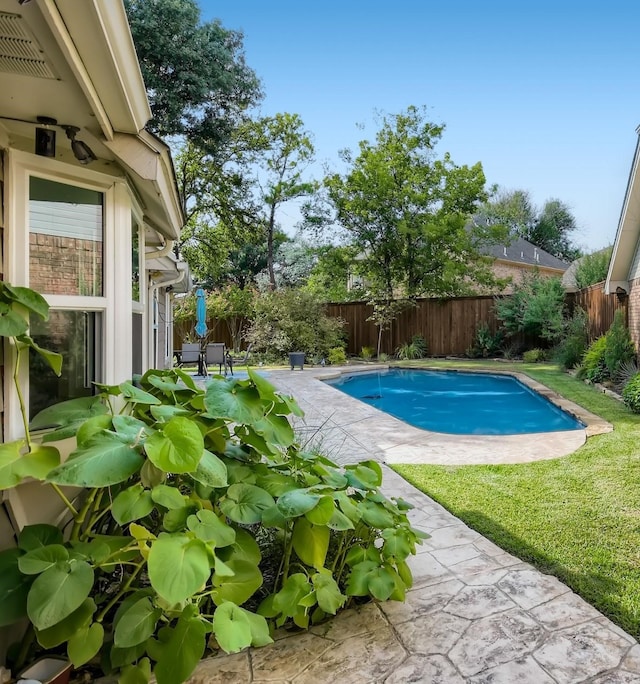 view of swimming pool featuring a patio area, a fenced backyard, and a fenced in pool