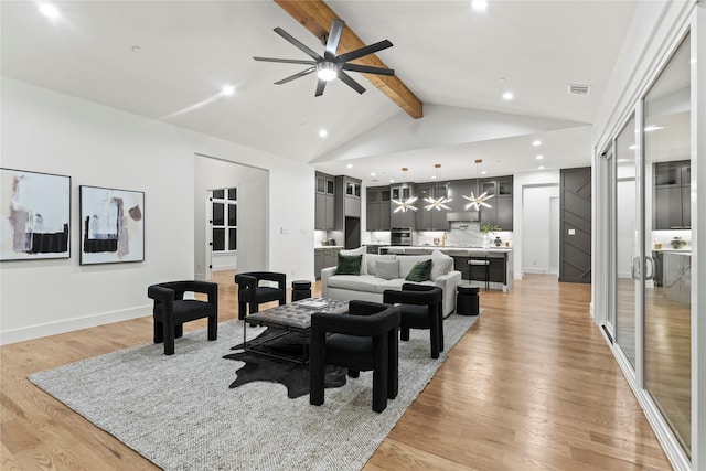 living room with high vaulted ceiling, light wood-style flooring, visible vents, a ceiling fan, and beamed ceiling