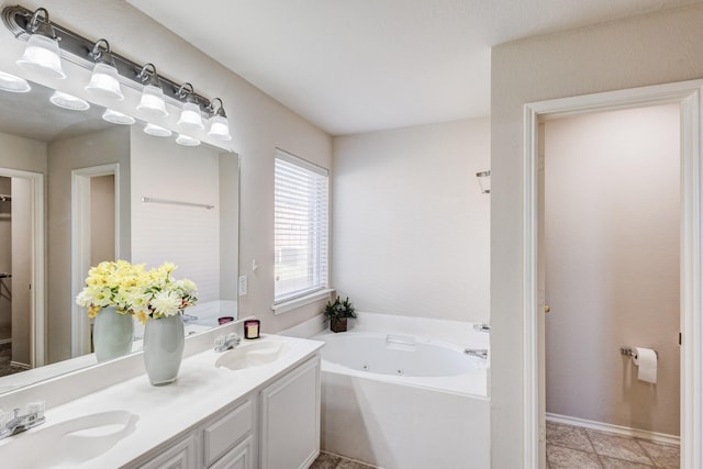 full bath featuring a whirlpool tub, double vanity, and a sink