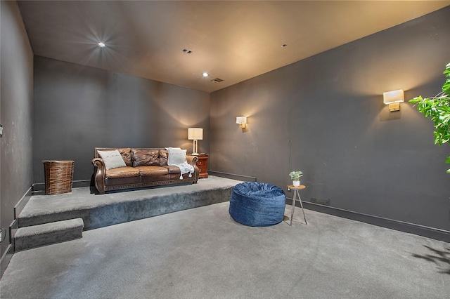 interior space featuring baseboards, visible vents, and carpet flooring