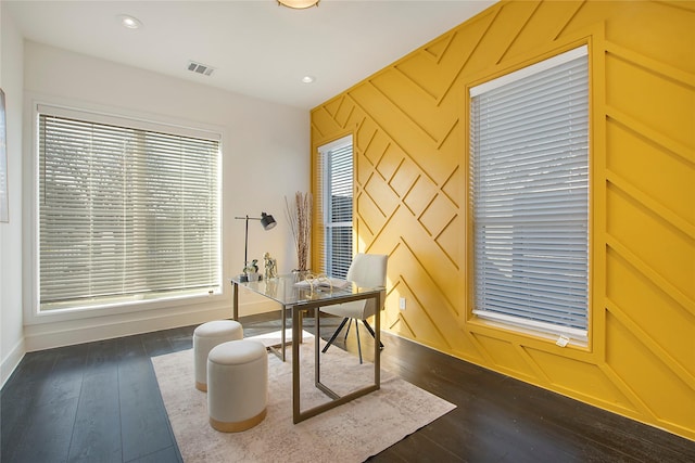 home office with baseboards, visible vents, an accent wall, dark wood-type flooring, and recessed lighting