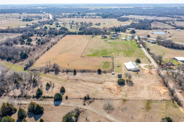 birds eye view of property with a rural view