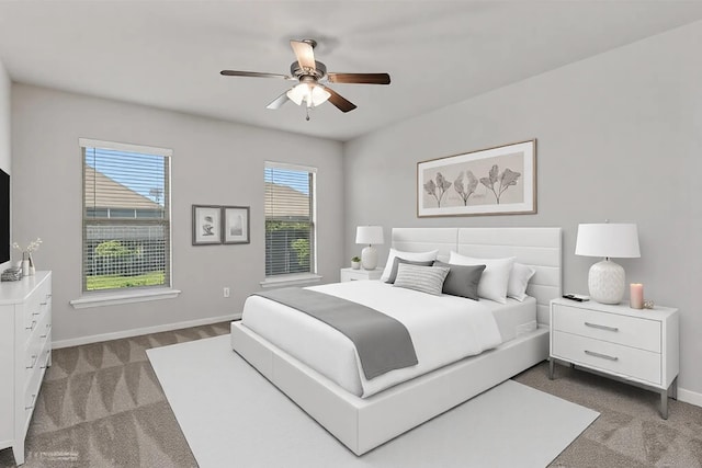 bedroom with ceiling fan, baseboards, and dark carpet