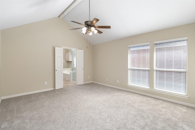 spare room with high vaulted ceiling, carpet floors, a ceiling fan, baseboards, and beam ceiling