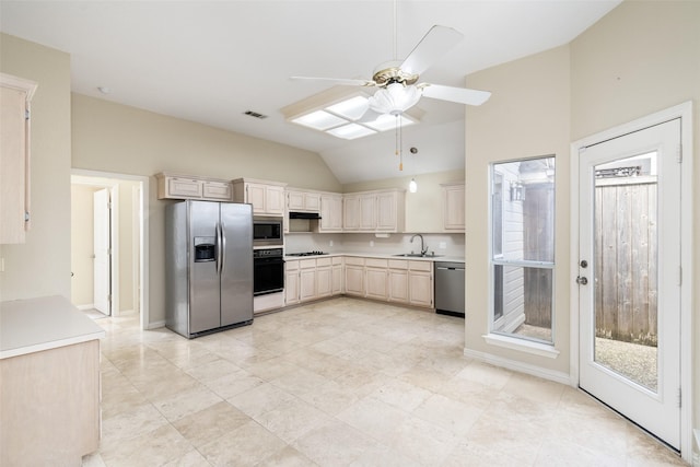 kitchen featuring visible vents, lofted ceiling, light countertops, black appliances, and a sink