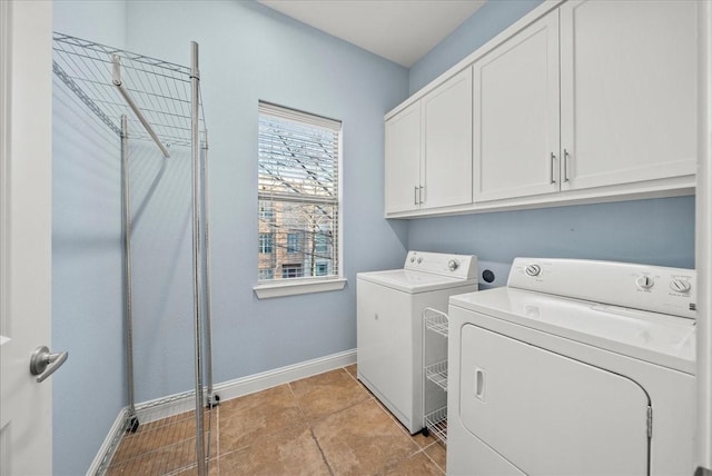 709 E 1st St, Fort Worth, TX 76102 - laundry area with cabinet space, washer and dryer, and baseboards