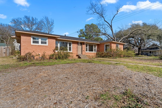 single story home with brick siding