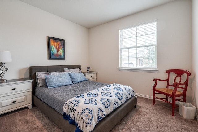 carpeted bedroom with baseboards