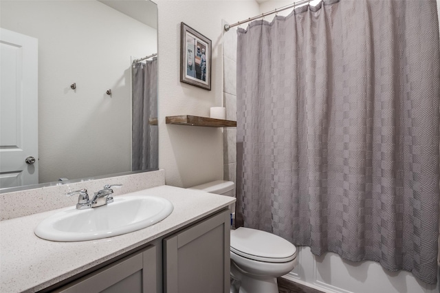 full bathroom with shower / tub combo with curtain, vanity, and toilet