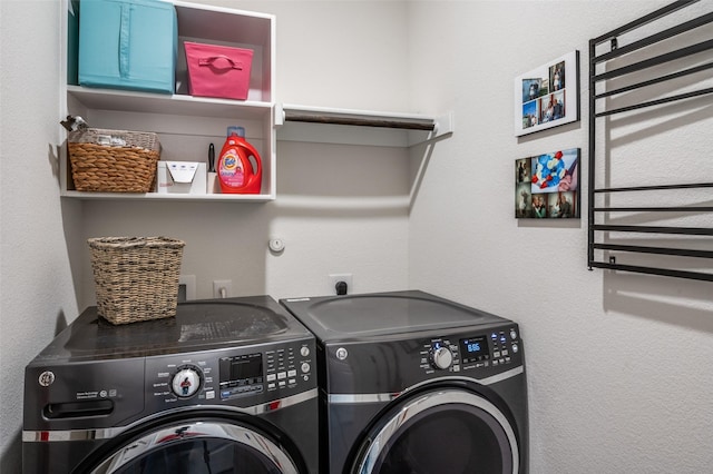 washroom featuring laundry area and independent washer and dryer