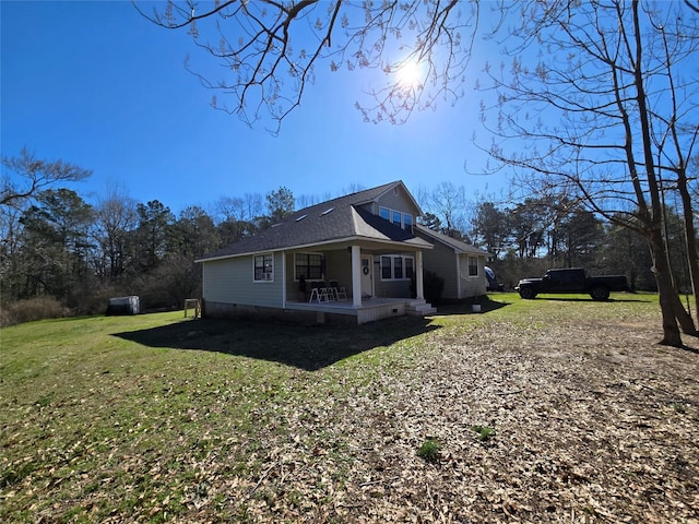 view of home's exterior with a patio area and a yard