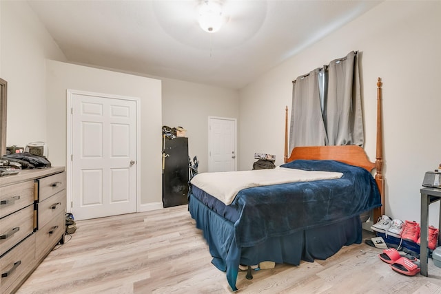 bedroom featuring light wood-type flooring and ceiling fan